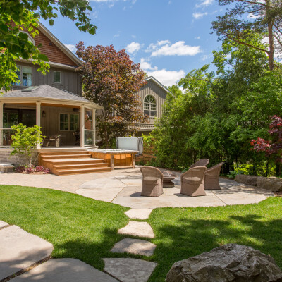 Backyard landscape with flagstone, patio and fire pit